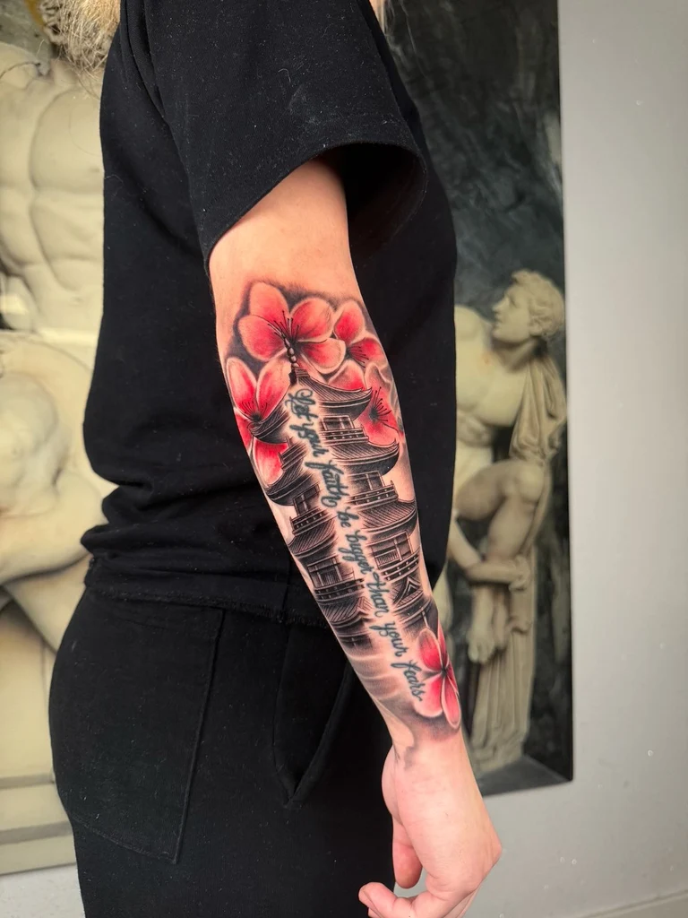 Black and grey chief with headdress shoulder tattoo