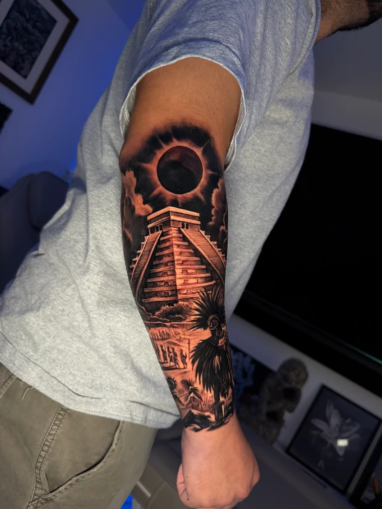 Pagoda with red cherry blossoms and script forearm tattoo